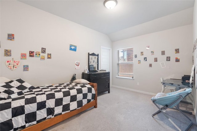 bedroom with lofted ceiling and light carpet