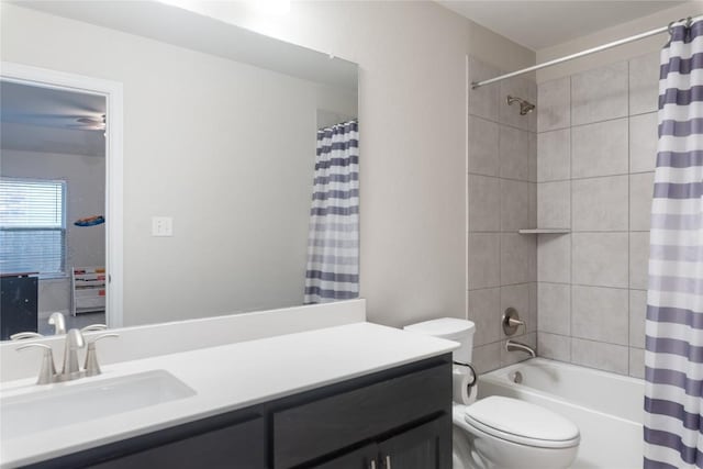 full bathroom with vanity, shower / bath combo, and toilet