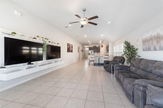 tiled living room featuring lofted ceiling and ceiling fan