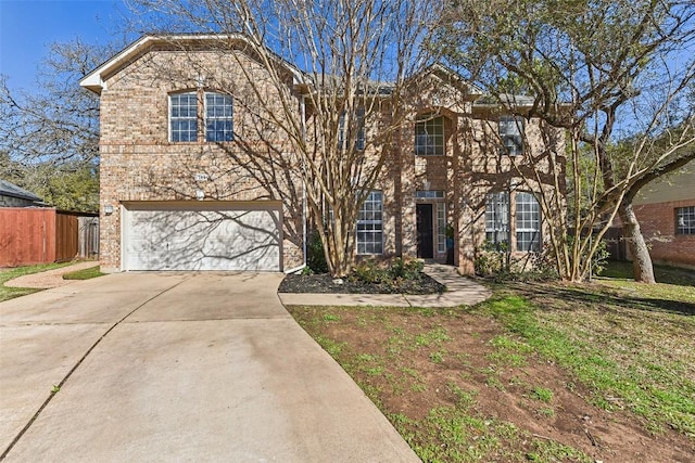 view of front of property with a garage, fence, concrete driveway, and brick siding