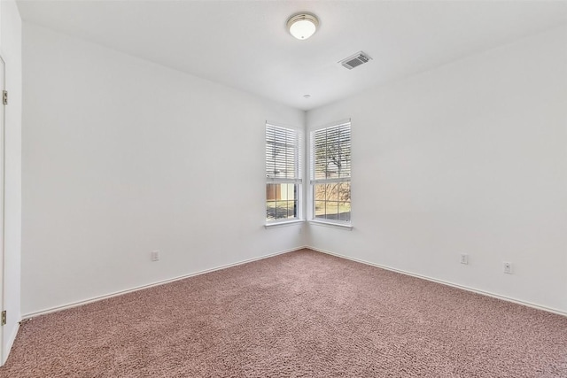 unfurnished room featuring carpet flooring