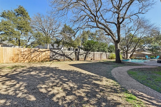 view of yard with a fenced backyard and a fenced in pool