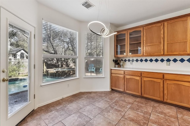 kitchen featuring pendant lighting and backsplash