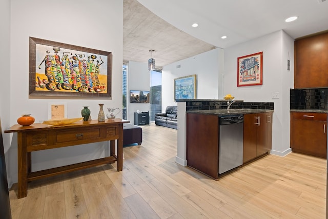 360 Nueces St Unit 914, Austin, TX 78701 - kitchen with dishwasher, light wood-style floors, tasteful backsplash, a wall of windows, and open floor plan