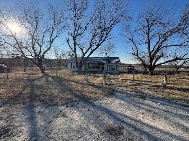 single story home featuring a rural view