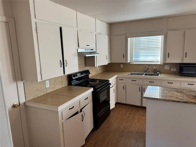 kitchen featuring white cabinetry, sink, decorative backsplash, and black appliances