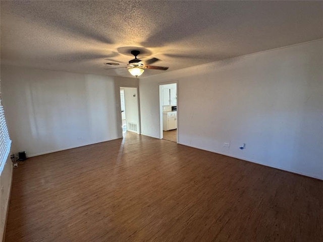 spare room with ceiling fan, wood-type flooring, and a textured ceiling