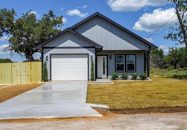 view of front facade with a garage and a front yard