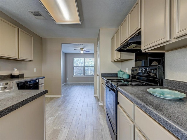 kitchen with a textured ceiling, light wood-type flooring, ceiling fan, cream cabinets, and black appliances