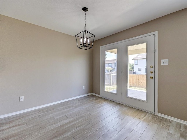 interior space featuring french doors and light wood-type flooring