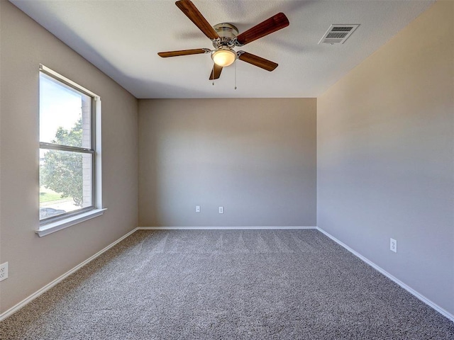 carpeted empty room with ceiling fan