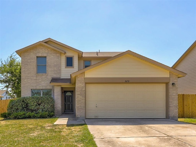 view of front of home with a garage and a front lawn