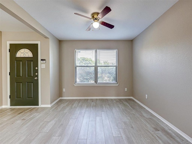 foyer featuring ceiling fan and light wood-type flooring