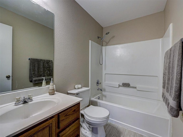 full bathroom featuring vanity, wood-type flooring, toilet, and shower / bath combination