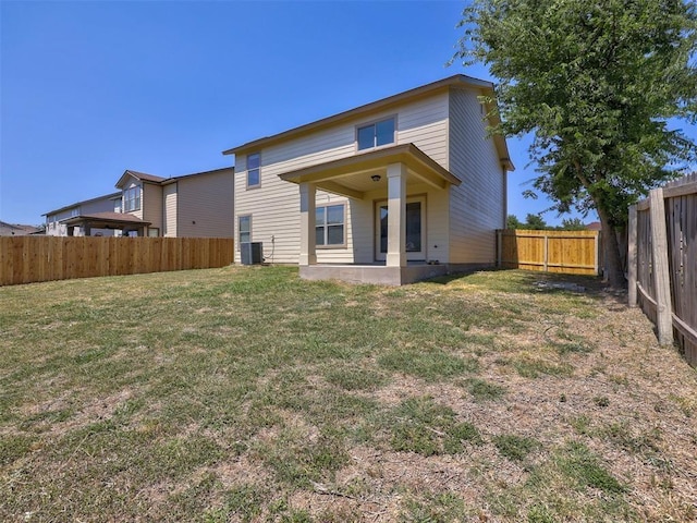 rear view of house with a lawn