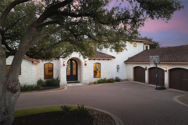 mediterranean / spanish-style house featuring a garage