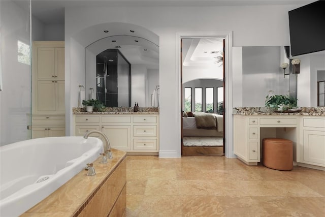 bathroom with vanity and a bathtub