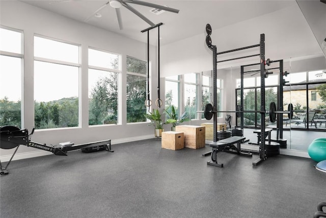 exercise room with ceiling fan