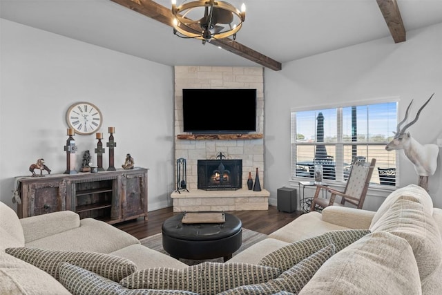 living room with beamed ceiling, dark wood-type flooring, a notable chandelier, and a fireplace