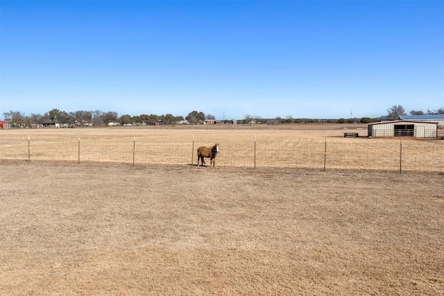 view of yard with a rural view