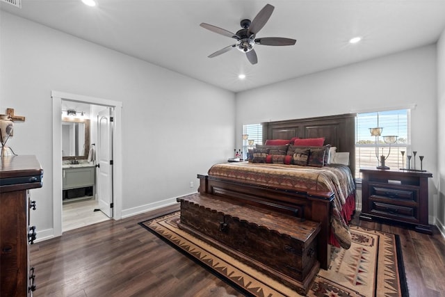 bedroom featuring ceiling fan, dark hardwood / wood-style floors, and ensuite bath