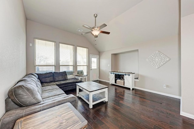 living room with lofted ceiling, dark hardwood / wood-style floors, and ceiling fan