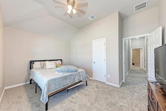 bedroom with lofted ceiling, light carpet, and ceiling fan