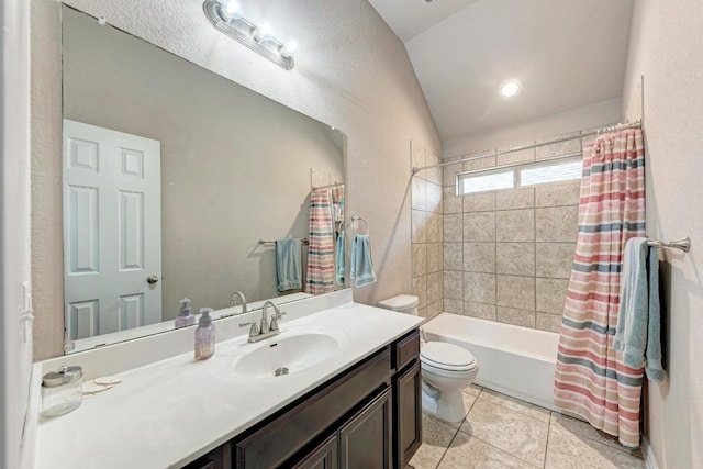 full bathroom with vaulted ceiling, tile patterned flooring, vanity, toilet, and shower / bath combo with shower curtain