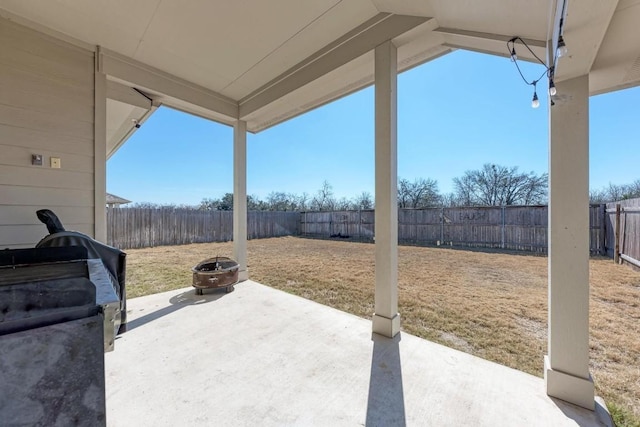 view of patio / terrace featuring an outdoor fire pit