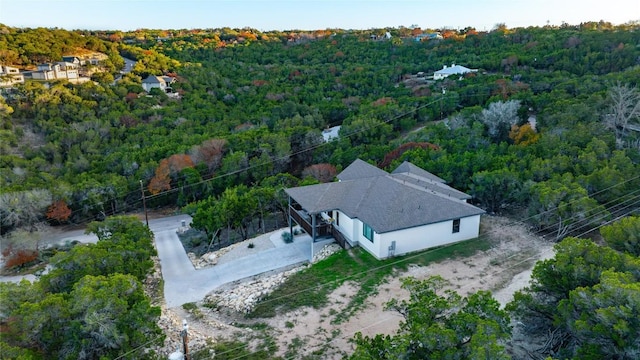 aerial view featuring a wooded view