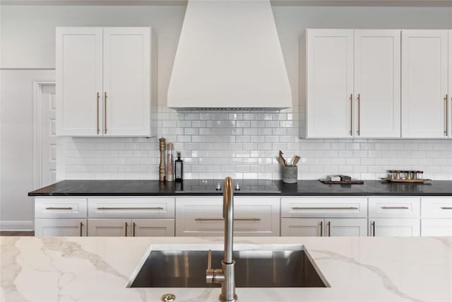 6200 Valleyview Dr, Lago Vista, TX 78645 - kitchen featuring a sink, premium range hood, white cabinetry, and black electric cooktop