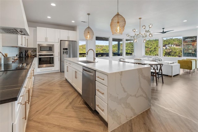 6200 Valleyview Dr, Lago Vista, TX 78645 - kitchen featuring a sink, premium range hood, stainless steel appliances, open floor plan, and recessed lighting