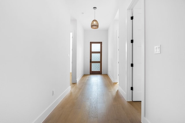 hall with light hardwood / wood-style floors