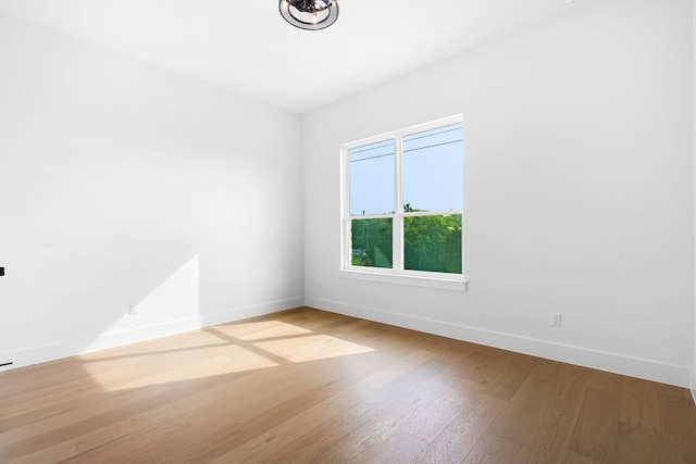 spare room featuring light hardwood / wood-style floors