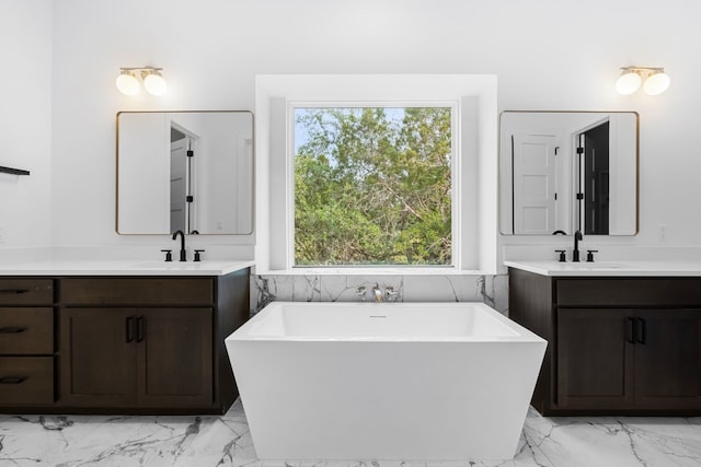 bathroom with vanity and a tub to relax in