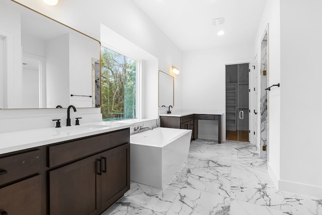 bathroom featuring vanity and shower with separate bathtub