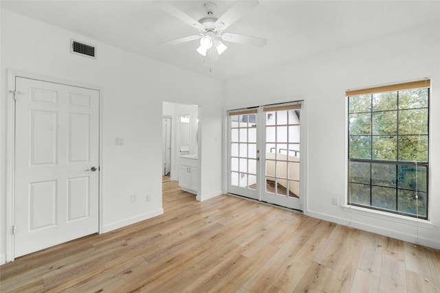 empty room featuring ceiling fan and light hardwood / wood-style floors