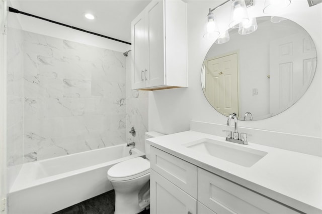 full bathroom with tiled shower / bath, vanity, and toilet