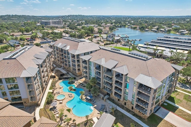 birds eye view of property with a water view