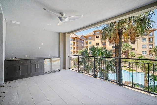 balcony with ceiling fan and sink