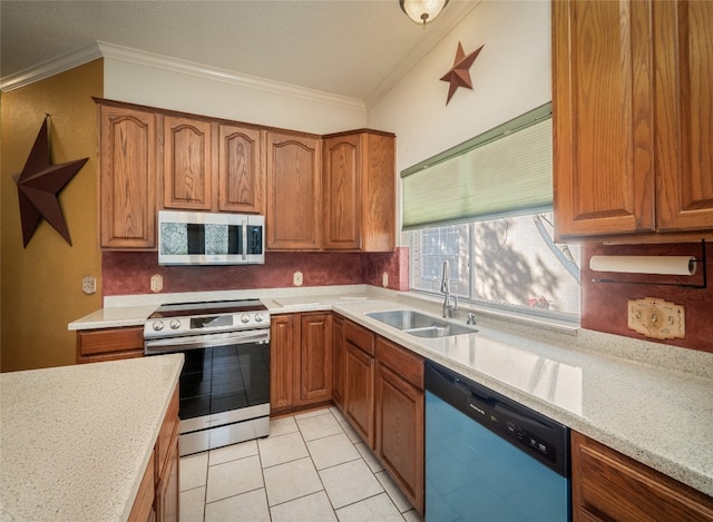 kitchen with sink, crown molding, stainless steel appliances, and light stone countertops