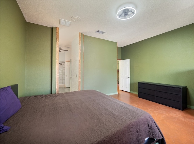 bedroom featuring a textured ceiling