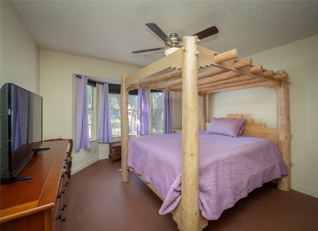 bedroom featuring ceiling fan and a textured ceiling