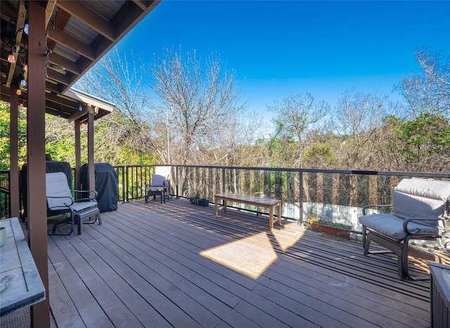 wooden deck with grilling area