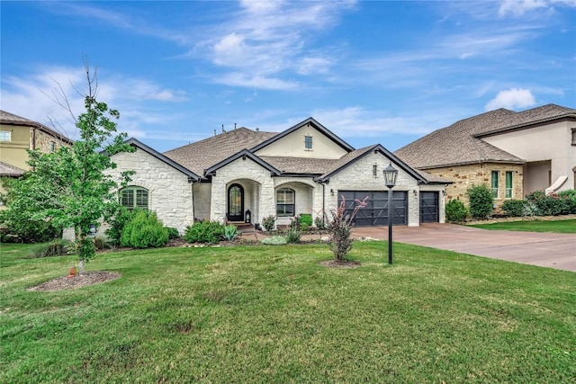 french provincial home with a garage and a front yard