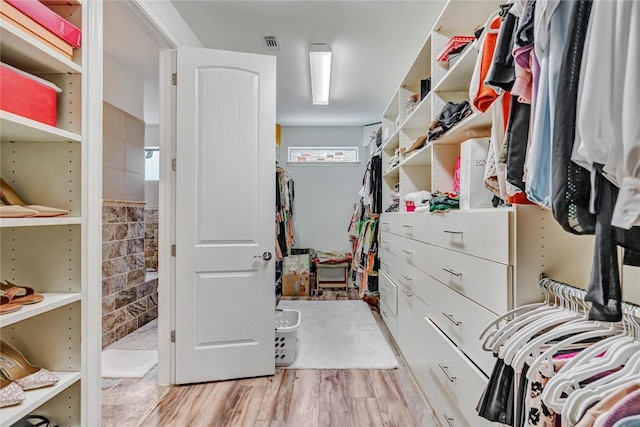 walk in closet featuring light wood-type flooring