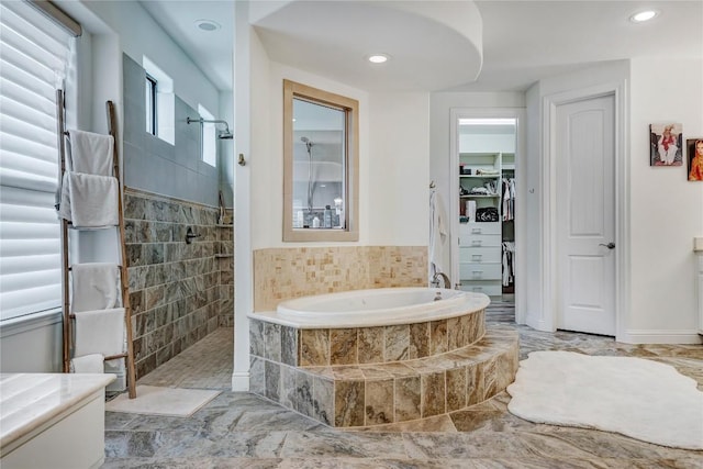 bathroom with separate shower and tub