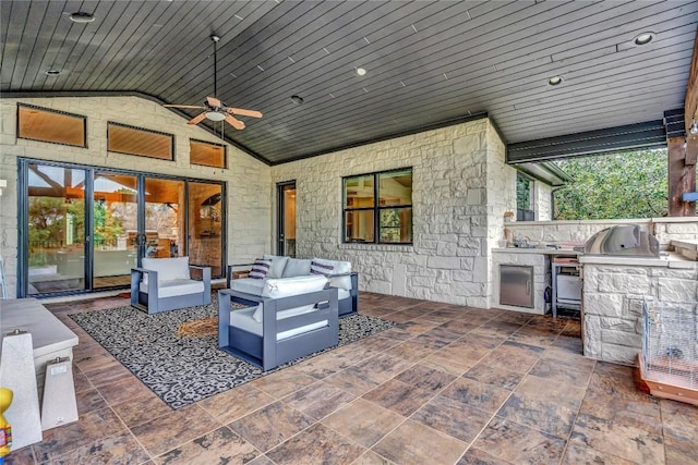 view of patio / terrace featuring area for grilling, sink, outdoor lounge area, and ceiling fan