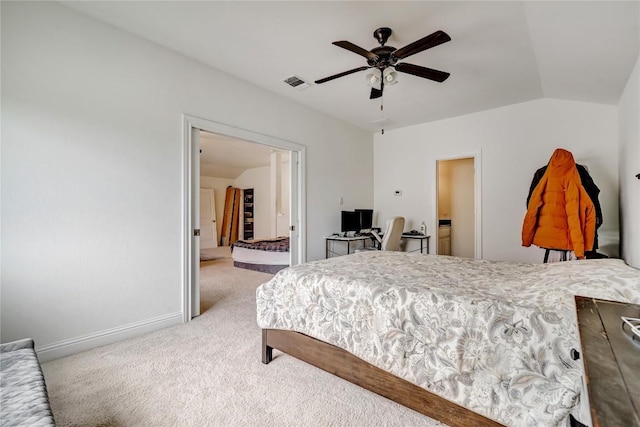 bedroom featuring ceiling fan, vaulted ceiling, and carpet