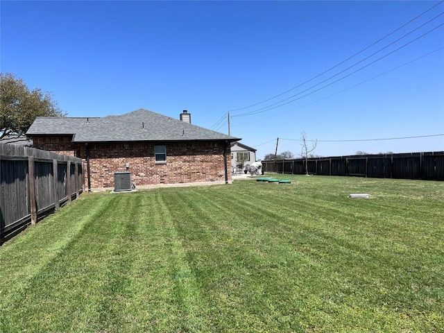 view of yard with central AC unit